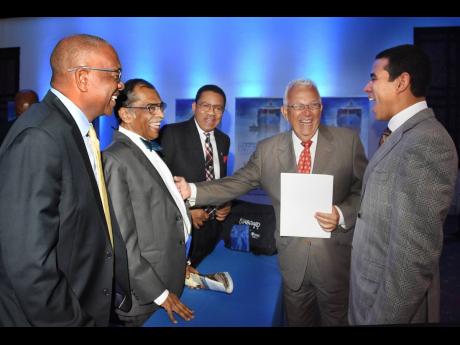 Sharing happiness: Harry’s laughter was contagious, as seen in this photo of him (second left) sharing a joke at a recent Caribbean Shipping Association (CSA) meeting with (from left) Trevor Riley, CEO of The Shipping Association of Jamaica (SAJ); Grantl