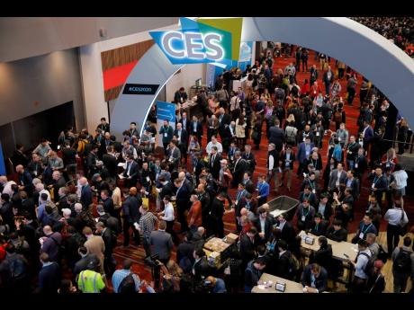 In this January 7, 2020 file photo, crowds enter the convention centre on the first day of the CES tech show in Las Vegas. 