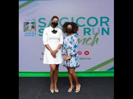  Tanya Lee (left), athlete manager, and Briana Williams, track athlete and 2021 Sigma Run patron, strike a stunning pose at the launch event.