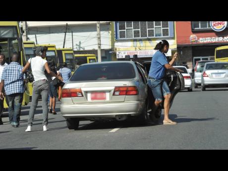 In this file photo, a taxi is seen dropping off passengers at South Parade, downtown Kingston.