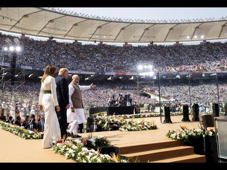 
US President Donald Trump, first lady Melania Trump, and Indian Prime Minister Narendra Modi arrive for a ‘Namaste Trump’, event at Sardar Patel Stadium, Monday, February 24, 2020, in Ahmedabad, India. 