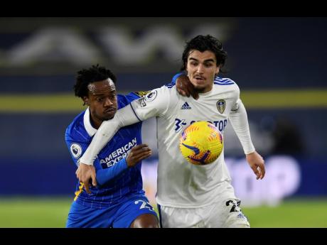 
Brighton’s Percy Tau (left) and Leeds United’s Pascal Struijk challenge for the ball during the English Premier League match between Leeds United and Brighton and Hove Albion at Elland Road Stadium in Leeds, England, yesterday. Brighton won 1-0.