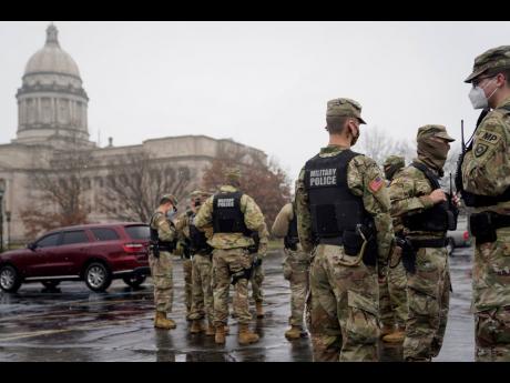 National Guard soldiers stand outside the Capitol building in Frankfort, Kentucky.