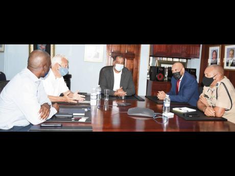 Listening intently: Commissioner of Police Major General Antony Anderson (second right) and his team met with representatives of the Shipping Association of Jamaica (SAJ) on Thursday, January 14, to discuss security and traffic arrangements at the port com