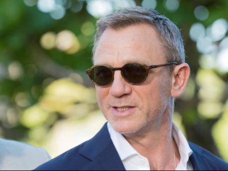 Daniel Craig poses for photographers during the photo call of the latest instalment of the James Bond film franchise, in Oracabessa, Jamaica on April 25, 2019. 