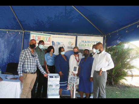  Representatives of the Chukka Foundation and Hanover Charities along with members of the medical fraternity at the Noel Holmes Hospital in Lucea, Hanover during the presentation of a suction machine and a vital sign monitor to the hospital by the two char