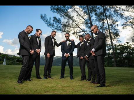 Friends that pray together stay together. Groom Ricardo Gordon (centre) is surrounded by his groomsmen (from left), Richard Gordon, Robin McFarlane, Matthew Waddell, Duane Gordon, Jeremy Thompson and Ainsley Deer.