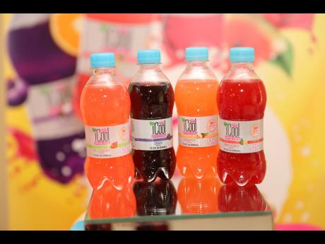 iCool juice drinks made and flavoured WATA drinks, both made by Jamaican manufacturers, are displayed. With the policy-mandated movement towards less sugar in drinks, there is expectation that regular drinks and flavuored waters could end up in direct comp