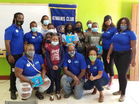 Members of the Kiwanis Club of Charlton-Alexandria with students who benefited from the club’s tablet-donation initiative. 
