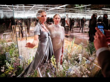 AT Top: Model Kate Moss (left) and her daughter, Lila Grace Moss, appeared on the Fendi runway together.