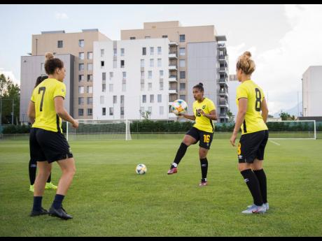 From left: Chinyelu Asher, Dominique Bond-Flasza, and Ashleigh Shimm at the Reggae Girlz’s training session during the FIFA Women’s World Cup at Stade Eugene Thenard in Grenoble, France, on Monday, June 17, 2019.