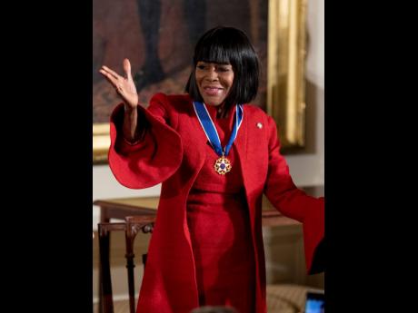 Actress Cicely Tyson blows a kiss after receiving the Presidential Medal of Freedom from President Barack Obama during a ceremony in the East Room of the White House, November 22, 2016, in Washington. Tyson, the pioneering Black actress who gained an Oscar