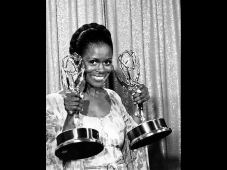 Cicely Tyson poses with her Emmy statuettes at the annual Emmy Awards presentation in Los Angeles, California, May 28, 1974. Tyson won for her role in ‘The Autobiography of Miss Jane Pittman’ for Actress of the Year, Special, and Best Lead Actress in a