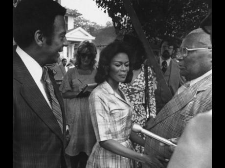 
From left: Ambassador Andrew Young talks to actress Cicely Tyson and Reverend Martin Luther King, Sr on the set of ‘Martin Luther King, Jr’ while it was filmed in Macon in 1977. 