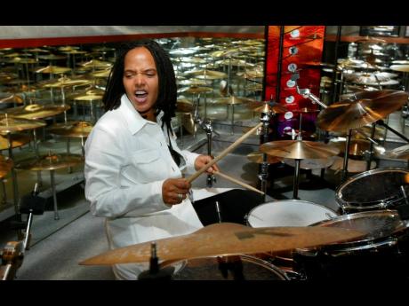 Drummer Terri-Lyne Carrington plays a set of drums with Zildjian cymbals, in a room of Zildjian cymbals, during the 380th anniversary of the famous cymbal maker in Norwell, Massachusetts, on May 9, 2003. 