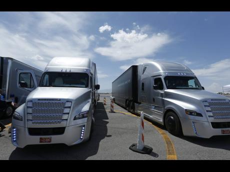 In this May 6, 2015 photo, a Daimler Freightliner Inspiration self-driving truck is loaded for a demonstration in Las Vegas. 