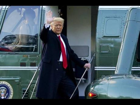 In this Wednesday, January 20, file photo, President Donald Trump waves as he boards Marine One on the South Lawn of the White House, in Washington, en route to his Mar-a-Lago Florida Resort. AP
