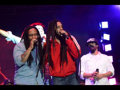 From left: Marley brothers Ky-Mani, Julian, and Damian pay tribute to their father, Bob Marley, during the commemoration of the late reggae icon’s 70th birthday anniversary. The concert was dubbed ‘Redemption Live’. 