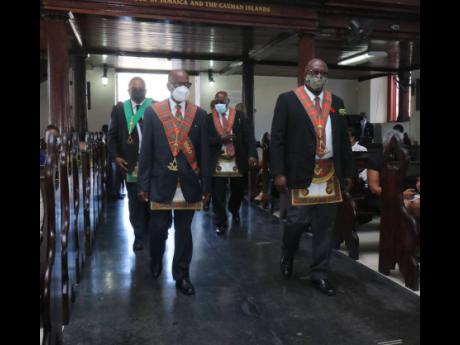 Members of the Masonic Lodge paying tribute at the late Ralph Smith at his funeral service held at the St James Parish Church in Montego Bay, St James, yesterday.