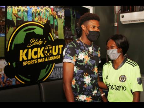 Proud owners of Blake’s Kickout Sports Bar and Lounge Andre Blake and his wife Shauna-Kay.