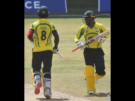 Jamaica Scorpions batting duo of Jeavor Royal (right) and Fabian Allen in action against the Leeward Islands Hurricanes during their Cricket West Indies Regional Super50 game at the Sir Vivian Richards Stadium in Antigua yesterday.