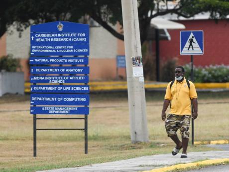 A man walks on the campus of The University of the West Indies, Mona on Sunday.