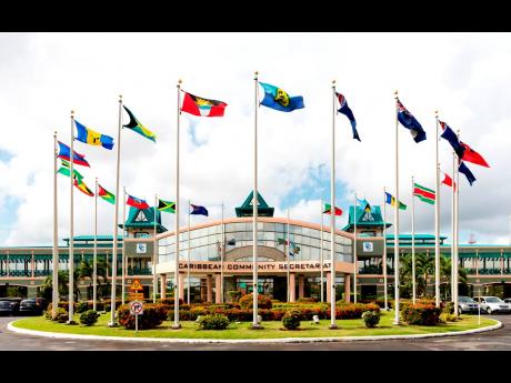 The flags of Caricom members fly at the secretariat in Georgetown, Guyana.