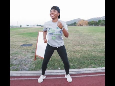 Jhana Edwards, senior sponsorship and promotions officer, Supreme Ventures, participates in a warm-up session before starting her walk. The Supreme Ventures team completed their virtual 5k run and walk on the track at the Calabar High School with TrainFit 
