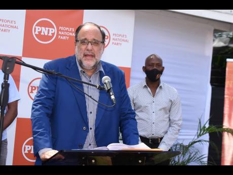 Opposition Leader Mark Golding addresses a press conference on Tuesday addressing the JAMCOVID data exposure and Jamaica’s vaccination campaign.