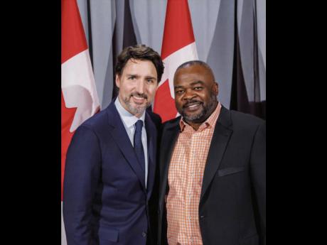 Chris Campbell (right), equity and diversity representative of the Carpenters’ District Council of  Ontario, is photographed with Justin Trudeau, prime minister of Canada.