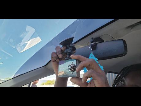 A dashcam being installed by Gooon Auto Services.