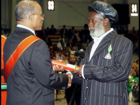 Winston ‘Burning Spear’ Rodney, receives his Order Of Distinction in the rank of Officer (OD) at the Ceremony of Investiture and Presentation of National Honours and awards 2007 at the National Indoor Sporting Centre on National Heroes Day Monday, Octo