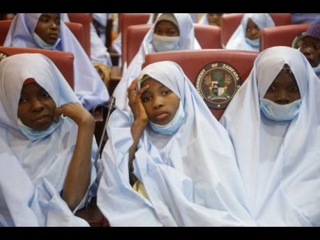 Some of the students who were abducted by gunmen from the Government Girls Secondary School, in Jangebe, last week are seen after their release meeting with the state Governor Bello Matawalle, in Gusau, northern Nigeria, yesterday.