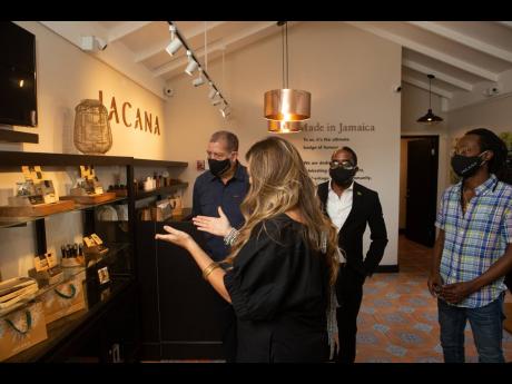 Jacana CEO Alexandra Chong (front) gives Audley Shaw, Norman Dunn and Jesse Royal a tour of the new Jacana location, including the new Original product line. 
