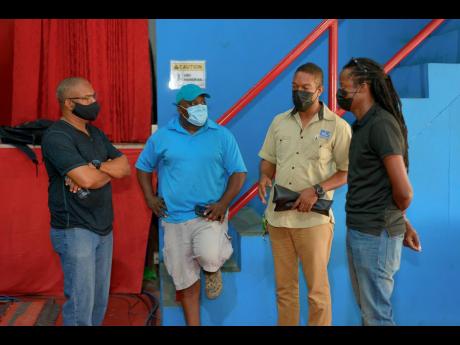From left: Rohan Amiel, Delroy Johnson, Roy Meikle and Gareth Daley discuss setup ahead of the virtual staging of the Jamaica Jazz and Blues Festival. The festival gets started tonight and ends on Saturday.
