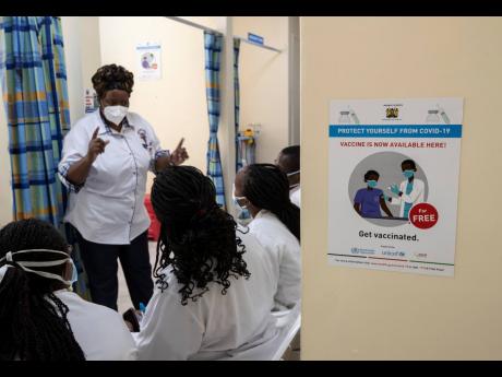 Medical staff wait in line to receive some of the country’s first coronavirus vaccinations using AstraZeneca COVID-19 vaccine manufactured by the Serum Institute of India and provided through the global COVAX initiative, at Kenyatta National Hospital in 