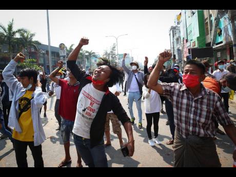 Protesters shout slogans during a protest against the military coup in Mandalay, Myanmar.