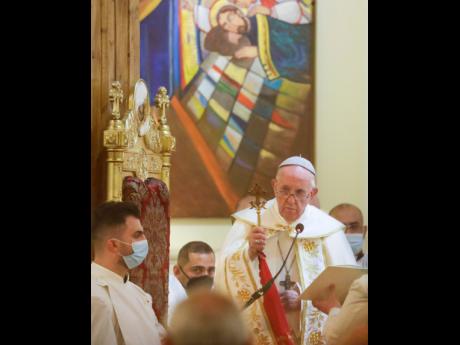 
Pope Francis concelebrates a mass in the Chaldean Cathedral of Saint Joseph in Baghdad, Iraq, yesterday.