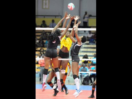 Jamaica’s Danaisha Moss (centre) goes up against Trinidad and Tobago’s Sinead Jack (left) and Renele Forde during the CAZOVA Senior Women’s Championships final at the National Indoor Sports Centre in 2017.