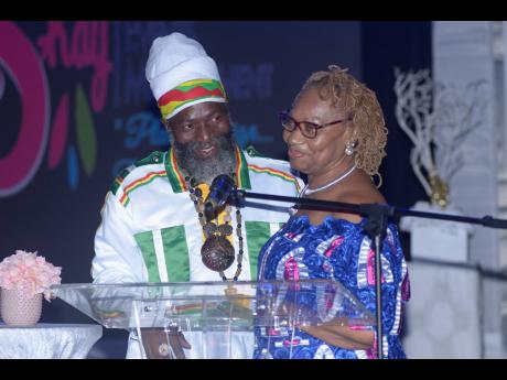 Claudette Kemp (right) is joined on stage by Capleton after she was given the Queen of Reggae Island Honorary Award in 2019. One of the few female managers in a music business, Kemp has managed the ‘Fireman’ entertainer for more than 21 years.