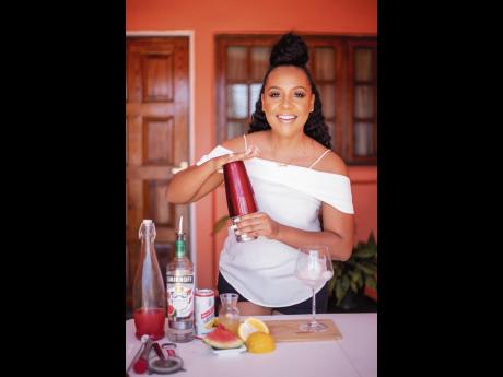 Mixologist Nicolina Diabo gives her Red Stripe Watermelon Spritzer a good, quick shake.