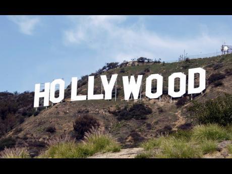 
The Hollywood sign appears near the top of Beachwood Canyon adjacent to Griffith Park in the Hollywood Hills of Los Angeles. For years, researchers have said a lack of diversity in Hollywood films doesn’t just poorly reflect demographics, it’s bad bus