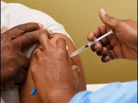 A man receives a dose of the Oxford/AstraZeneca vaccine at St Joseph’s Hospital on Saturday. 