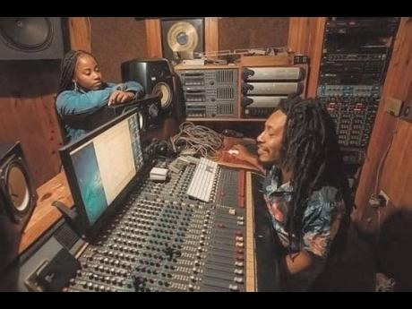 Bailey (left), who goes by the name ‘JQ’, works in studio with producer, Sheldon ‘Calibud’ Stewart. 