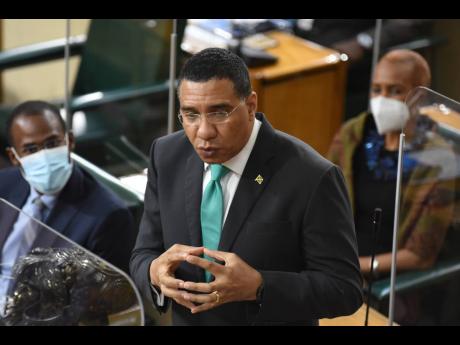 Prime Minister Andrew Holness addresses legislators during his Budget Debate presentation in Parliament on Thursday. The prime minister warned of tougher COVID-19 restrictions when the current measures expire next week. 