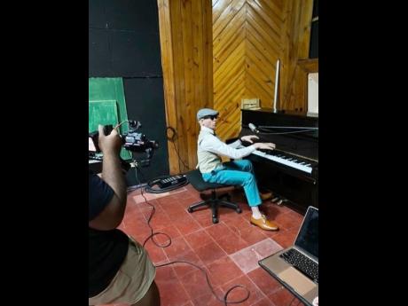 King Yellowman plays the piano during the recording of his music video for ‘Kiss me each Morning’. 