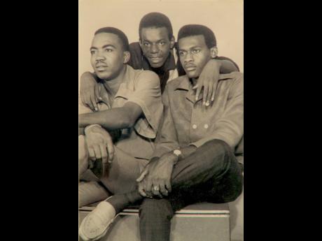 Members of the Uniques (from left), Lloyd Charmers, Slim Smith and Jimmy Riley, pose at a photo shoot for their album, ‘Absolutely the Uniques’. Riley was a member of the group in his early years of doing music.