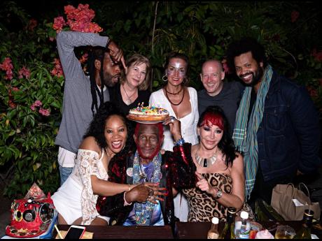Lee ‘Scratch’ Perry having a little fun as he is surrounded by family and friends for his 85th birthday celebration. Standing (from left): Brian; Karen Spinelli; Britta Slippens; Eric Schuman, who travelled from Switzerland for the dinner; and film-mak
