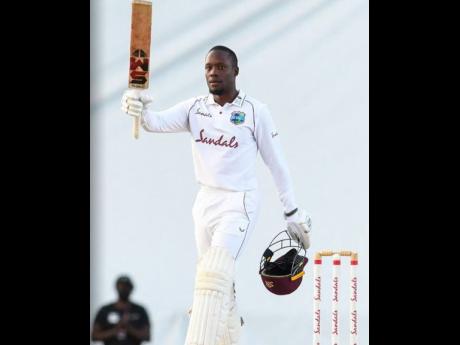 
West Indies batsman Nkrumah Bonner celebrates his maiden Test century on the final day of their first Test match against Sri Lanka, at the Sir Vivian Richards Stadium in St John’s Antigua yesterday.