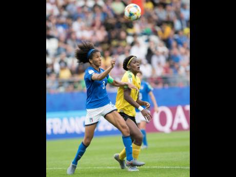 Khadija Shaw (right) of Jamaica and Italy's Sara Gama compete for possession of the ball in the Jamaica vs Italy fixture in the FIFA Women's World Cup 2019 at Stade Auguste-Delaune in Reims, France, on Friday June 14, 2019. Jamaica suffered a 5-0 loss at t